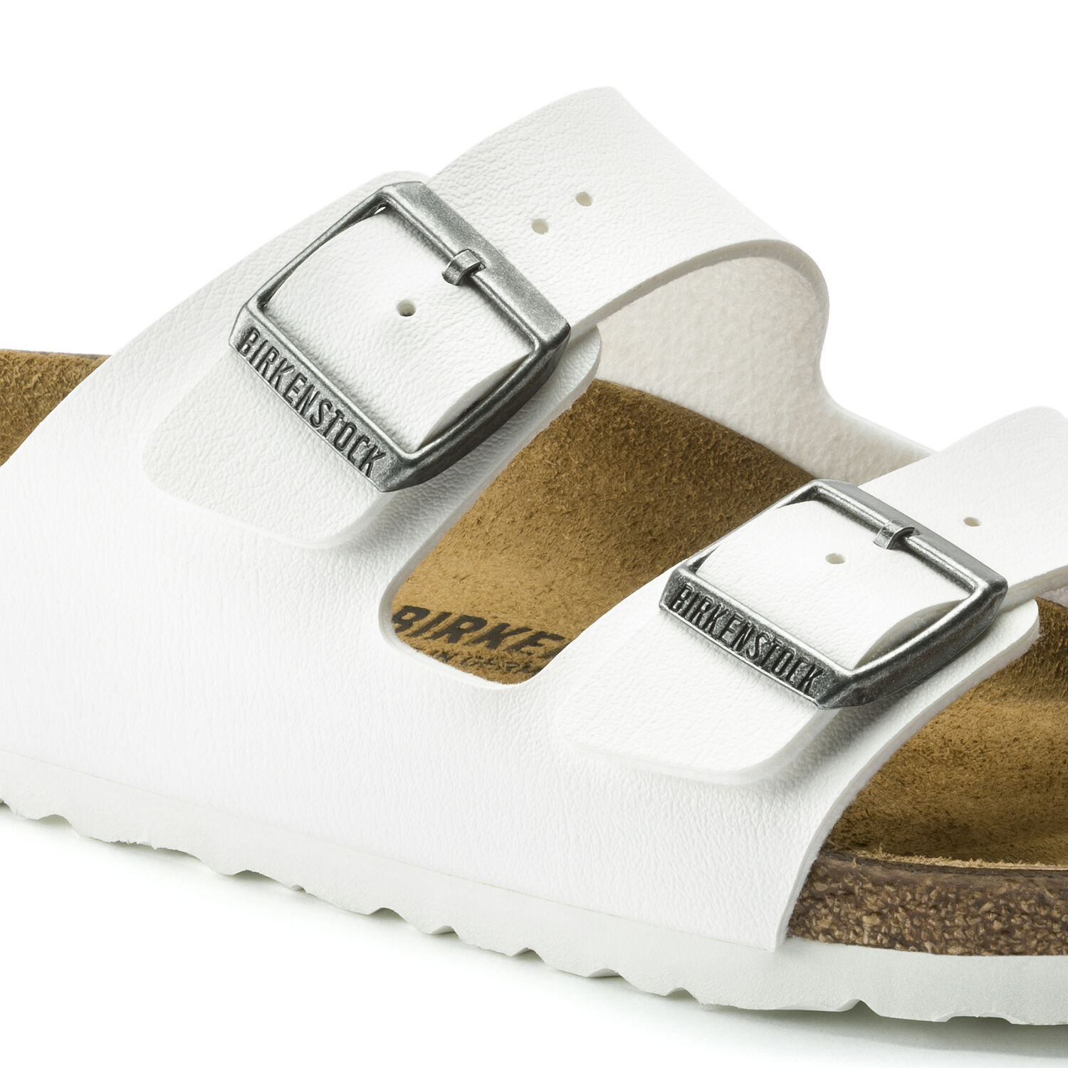 white birkenstocks with gold buckles